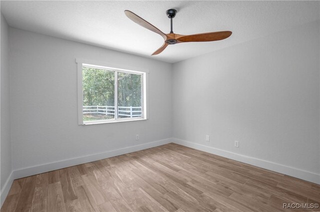5079 W Pinto Loop, Beverly Hills, FL 34465 - empty room featuring ceiling fan, wood finished floors, and baseboards