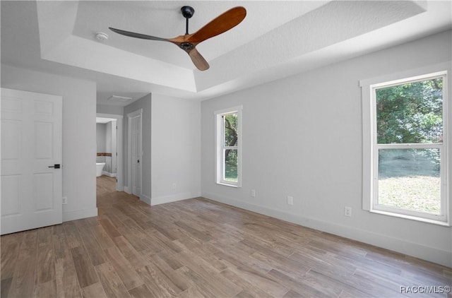 5079 W Pinto Loop, Beverly Hills, FL 34465 - unfurnished room featuring a tray ceiling, ceiling fan, wood finished floors, a smoke detector, and baseboards