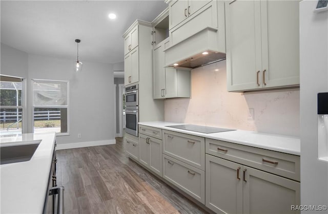 5079 W Pinto Loop, Beverly Hills, FL 34465 - kitchen featuring black electric stovetop, light countertops, dark wood-style flooring, decorative light fixtures, and recessed lighting