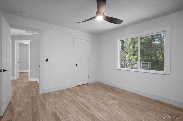 5079 W Pinto Loop, Beverly Hills, FL 34465 - unfurnished bedroom featuring baseboards, light wood-type flooring, and ceiling fan