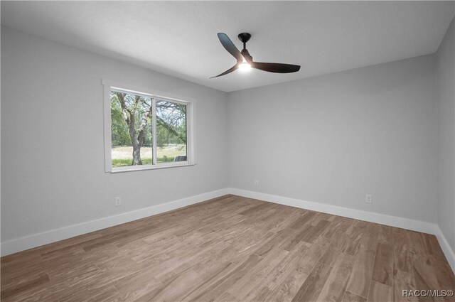 5079 W Pinto Loop, Beverly Hills, FL 34465 - empty room with wood finished floors, a ceiling fan, and baseboards