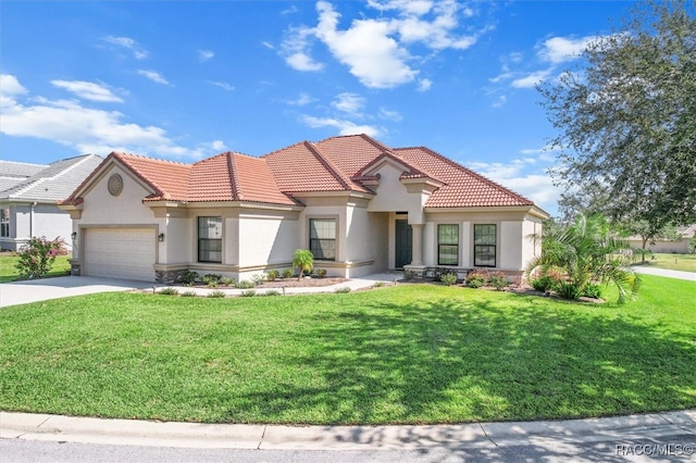 mediterranean / spanish-style house with a front lawn and a garage