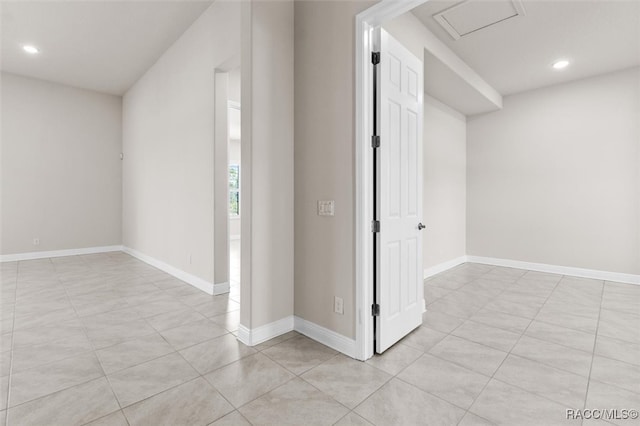 corridor featuring light tile patterned flooring