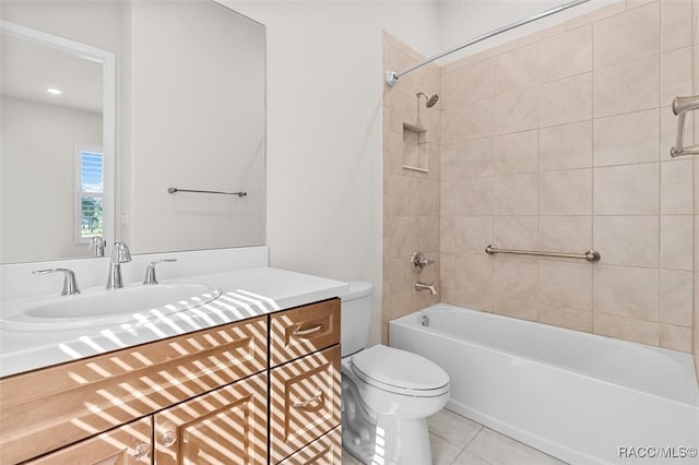 full bathroom with toilet, vanity, tiled shower / bath combo, and tile patterned floors