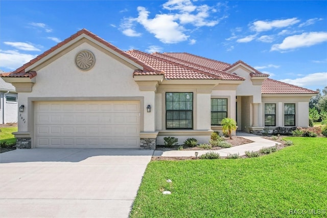 mediterranean / spanish-style house with a garage and a front lawn