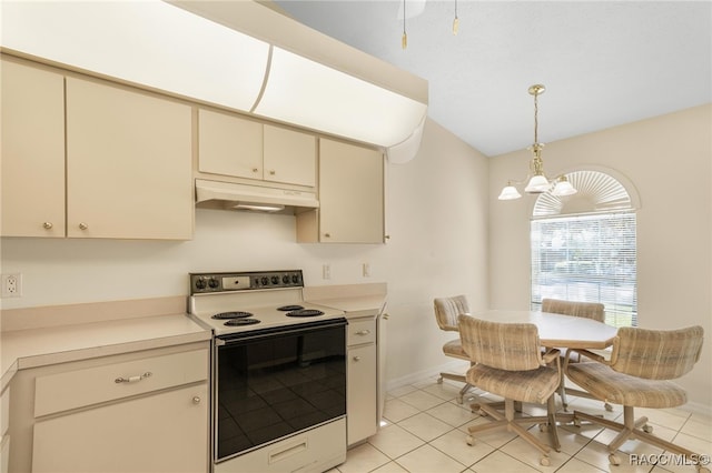 kitchen featuring cream cabinetry, light tile patterned floors, hanging light fixtures, and electric stove