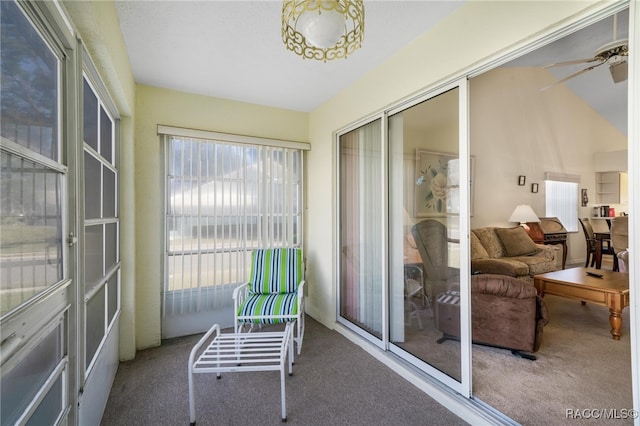 sunroom / solarium with ceiling fan