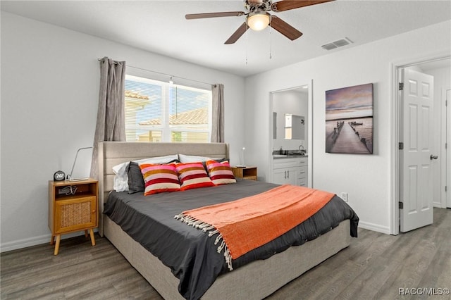 10200 W Waterlander Loop, Homosassa, FL 34448 - bedroom with light wood-style flooring, baseboards, and ensuite bathroom