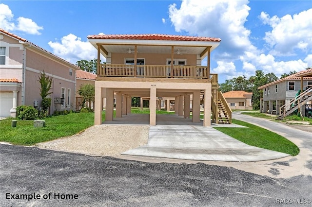 10200 W Waterlander Loop, Homosassa, FL 34448 - view of front of house featuring a carport, stairway, driveway, and stucco siding