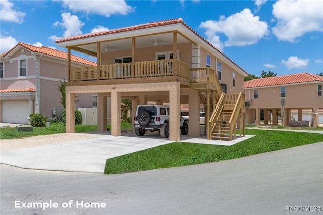 10200 W Waterlander Loop, Homosassa, FL 34448 - view of front of property with a carport, concrete driveway, a tiled roof, ceiling fan, and stucco siding