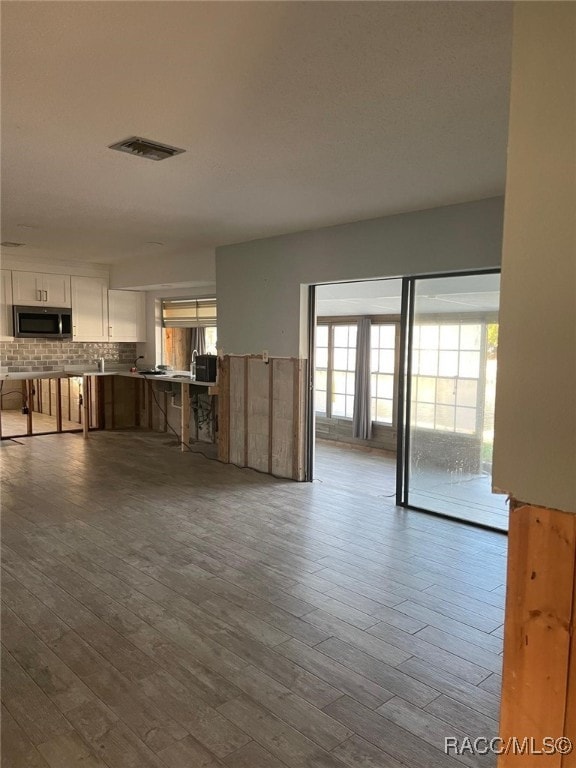 unfurnished living room with light wood-type flooring