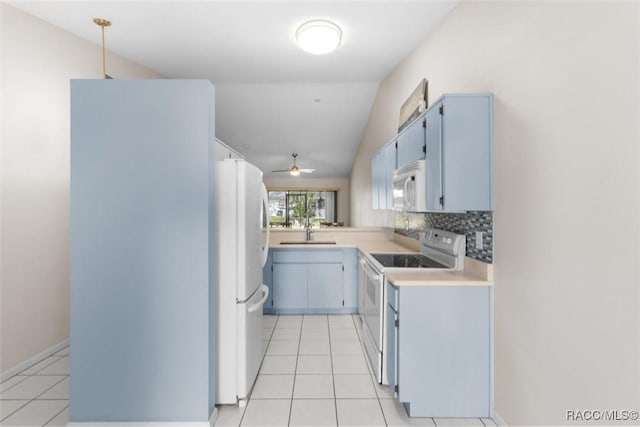 477 Siesta Ter, Inverness, FL 34450 - kitchen featuring white appliances, light countertops, a sink, light tile patterned flooring, and tasteful backsplash