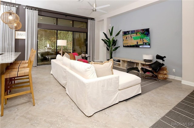 living room featuring ceiling fan