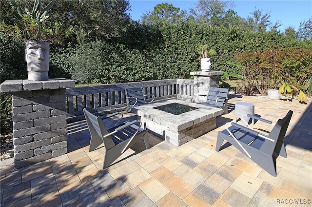 view of patio / terrace featuring a fire pit