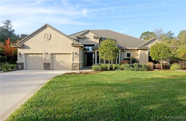 view of front facade with a garage and a front lawn