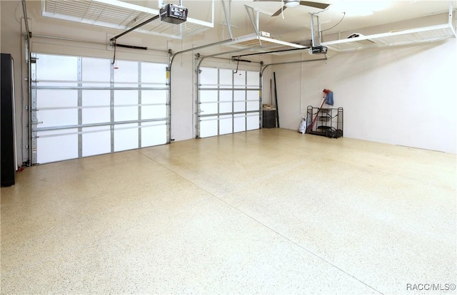 garage featuring a garage door opener and ceiling fan