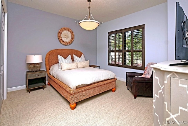 carpeted bedroom with a textured ceiling