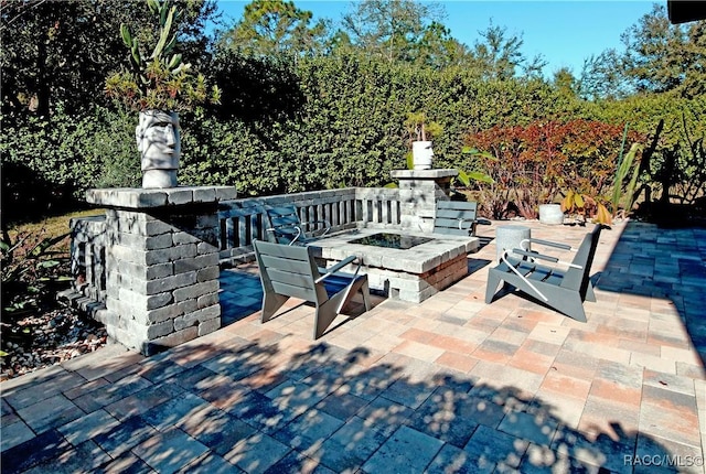 view of patio / terrace with a fire pit