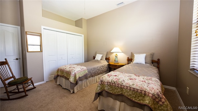 carpeted bedroom featuring a closet