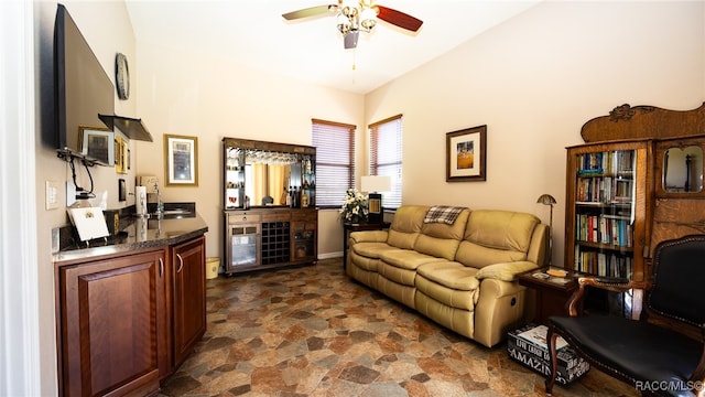 living room featuring ceiling fan and sink