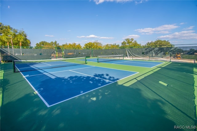 view of sport court with basketball hoop