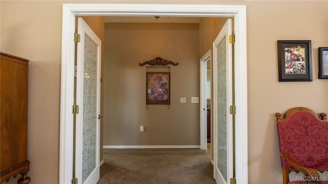 hallway with dark carpet