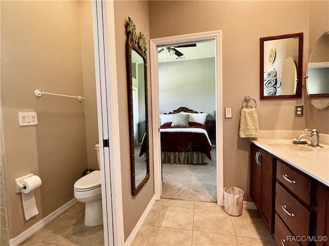 bathroom featuring ceiling fan, tile patterned flooring, vanity, and toilet