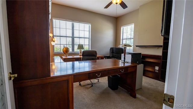 carpeted home office with ceiling fan