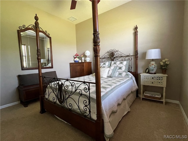 bedroom featuring ceiling fan, carpet floors, and vaulted ceiling