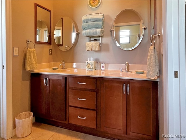 bathroom with tile patterned floors and vanity