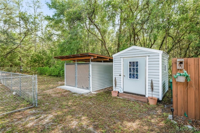 view of shed with fence