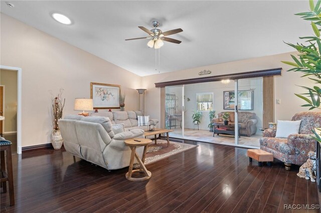 living room featuring ceiling fan, lofted ceiling, and hardwood / wood-style flooring