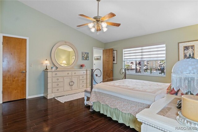 bedroom featuring vaulted ceiling, ceiling fan, and dark hardwood / wood-style floors