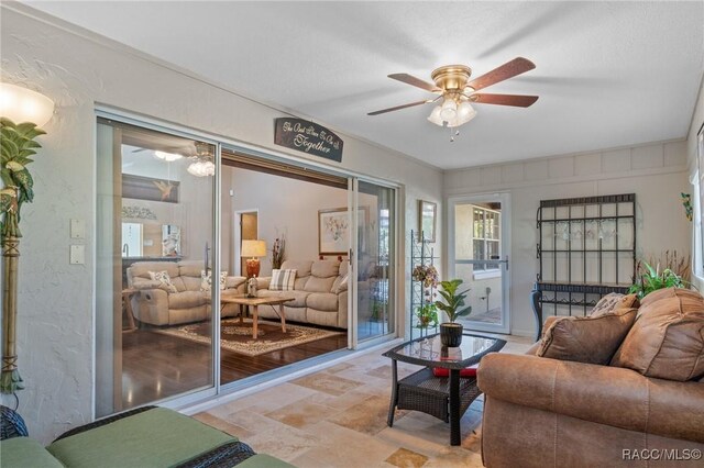 living room with ceiling fan