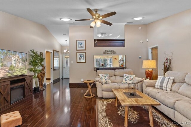 living room with dark hardwood / wood-style floors, vaulted ceiling, and ceiling fan