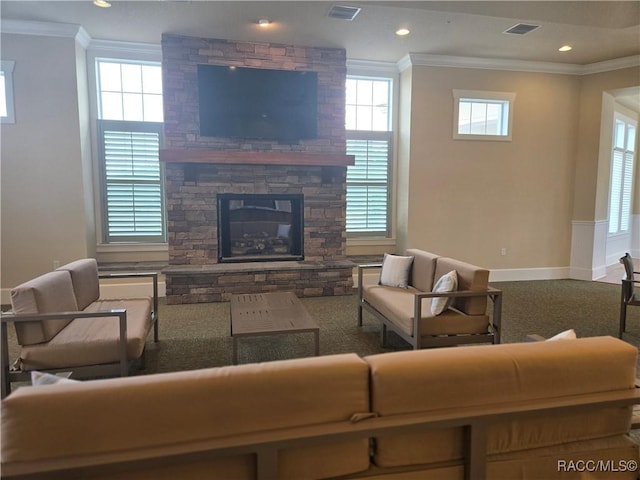 1003 Heron Point Dr, Inverness, FL 34453 - living area featuring crown molding, baseboards, visible vents, and a fireplace