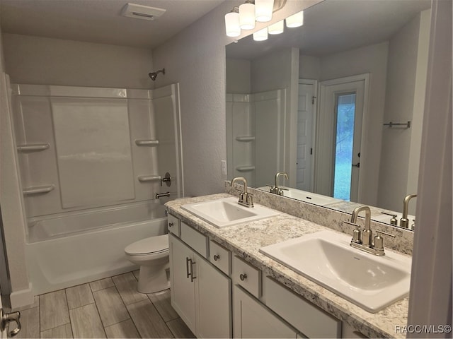 full bathroom with vanity, toilet, and shower / bath combination