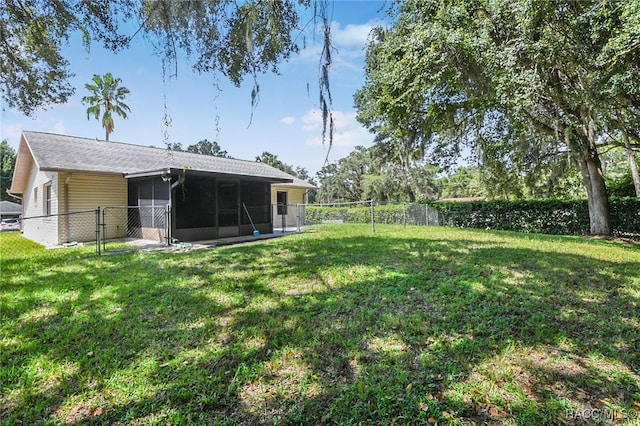 view of yard featuring a sunroom