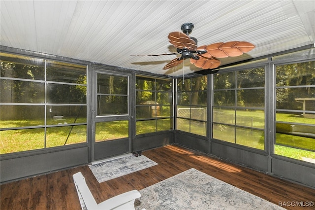 unfurnished sunroom with ceiling fan and lofted ceiling