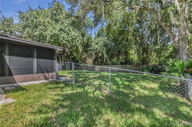 view of yard featuring a sunroom