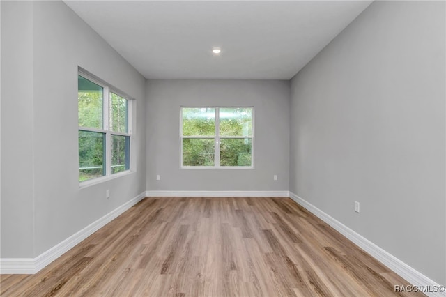 7024 N Fountainhead Dr, Citrus Springs, FL 34433 - unfurnished room with light wood-style floors and baseboards