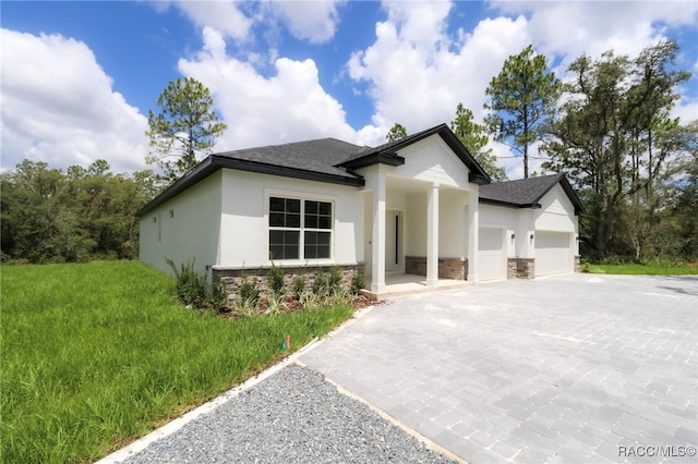 7024 N Fountainhead Dr, Citrus Springs, FL 34433 - view of front of home featuring decorative driveway, an attached garage, a shingled roof, and stucco siding