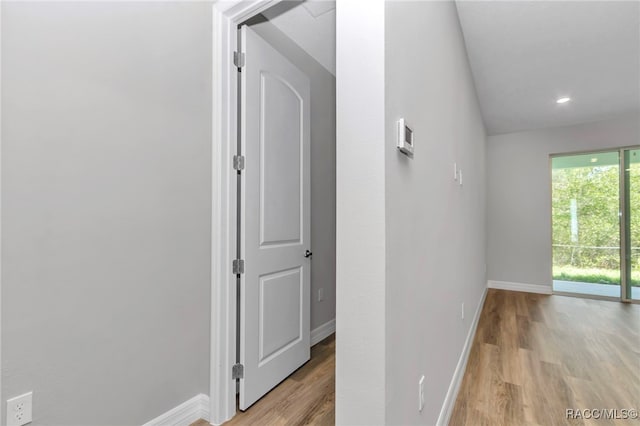 7024 N Fountainhead Dr, Citrus Springs, FL 34433 - hallway featuring light wood finished floors