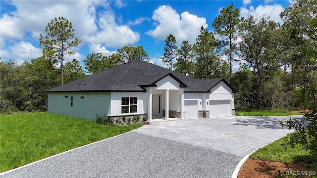 7024 N Fountainhead Dr, Citrus Springs, FL 34433 - view of front of property with decorative driveway, an attached garage, stucco siding, a front yard, and stone siding