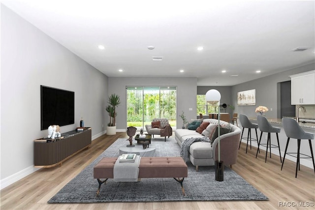 7024 N Fountainhead Dr, Citrus Springs, FL 34433 - living area with light wood-style floors and recessed lighting