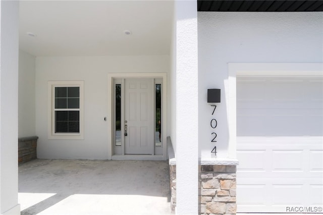 7024 N Fountainhead Dr, Citrus Springs, FL 34433 - view of exterior entry featuring stucco siding