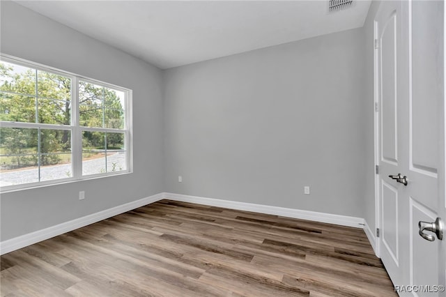 7024 N Fountainhead Dr, Citrus Springs, FL 34433 - unfurnished room with baseboards and wood finished floors