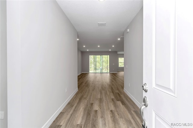 7024 N Fountainhead Dr, Citrus Springs, FL 34433 - corridor with wood finished floors and recessed lighting