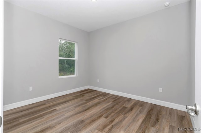 7024 N Fountainhead Dr, Citrus Springs, FL 34433 - unfurnished room featuring wood finished floors
