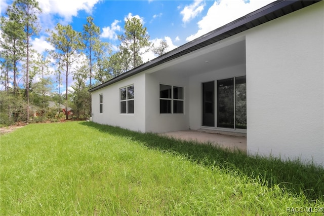 7024 N Fountainhead Dr, Citrus Springs, FL 34433 - view of grassy yard featuring a patio area